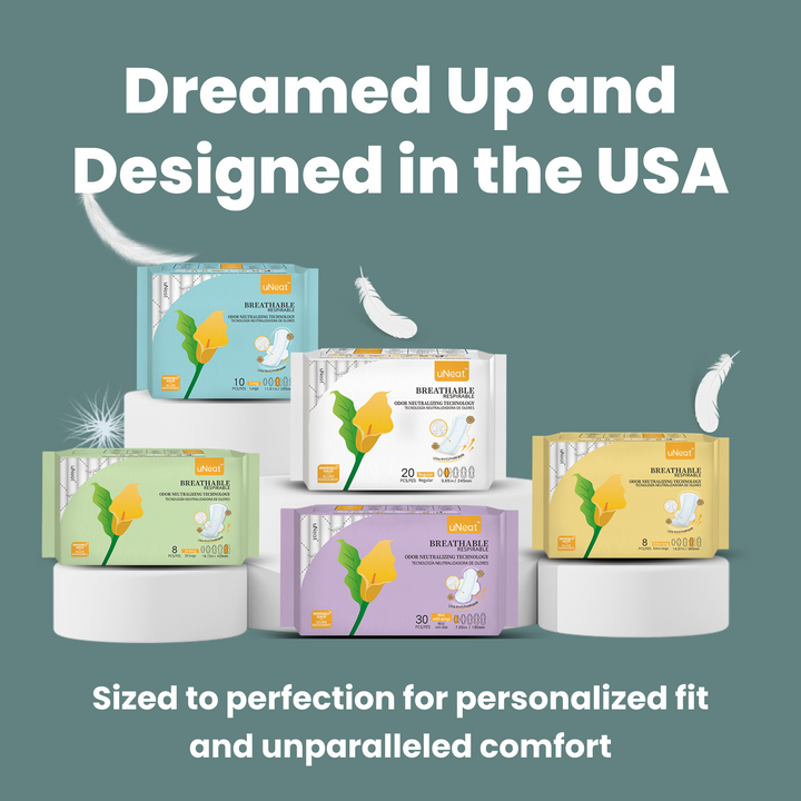 Close-up of uNeat Breathable Sanitary Pads in various sizes. Blue background. Text on image: "Dreamed Up & Designed in the USA. Sized for Personalized Fit & Unparalleled Comfort.”